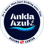 ankla-azul-diving-center-logo Official circular logo of Ankla Azul Diving Center, featuring a wave, anchor, dive flag, and the text "It's more than just kicking your fins."