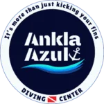 ankla-azul-diving-center-logo Official circular logo of Ankla Azul Diving Center, featuring a wave, anchor, dive flag, and the text "It's more than just kicking your fins."